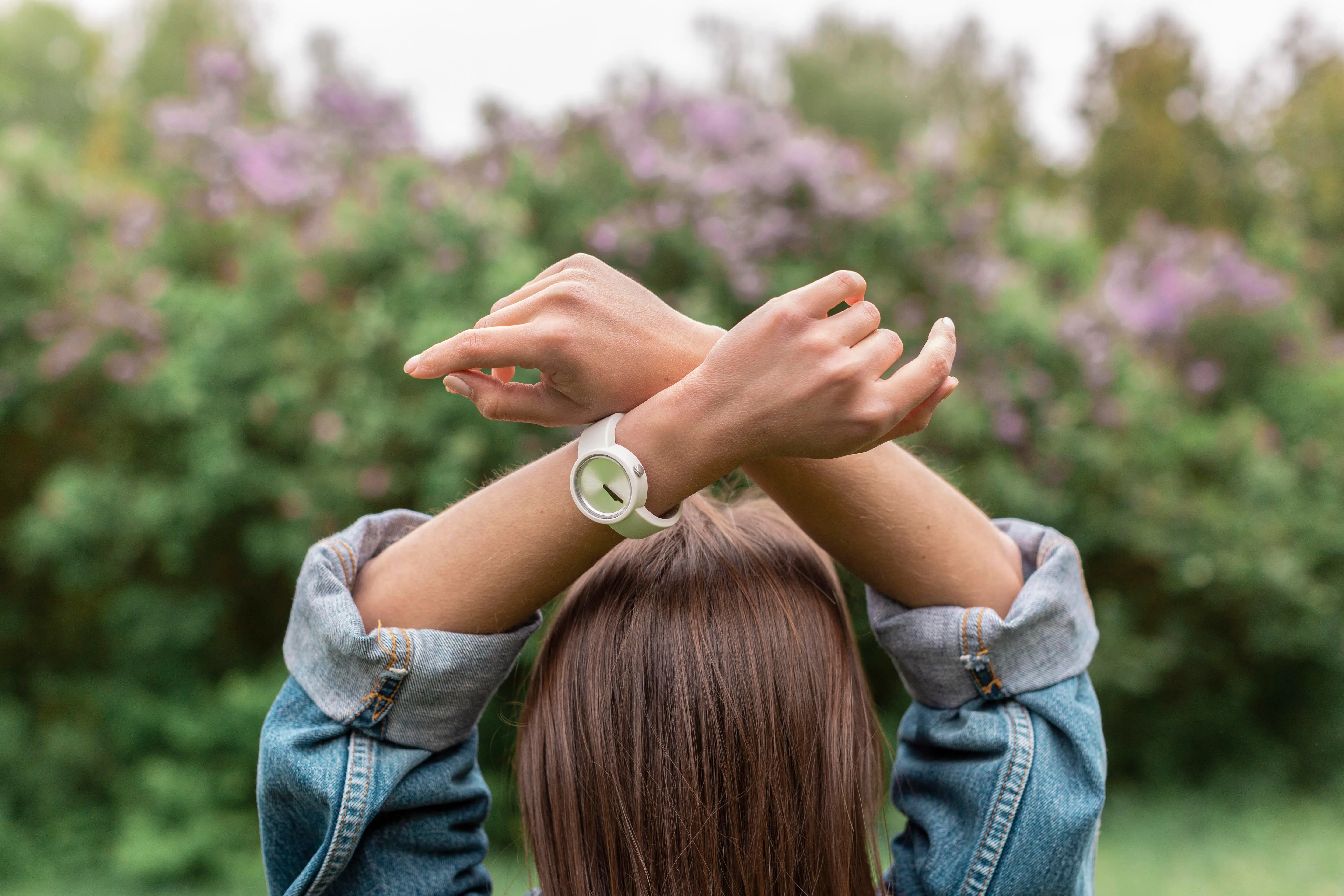 A woman with hands over her head