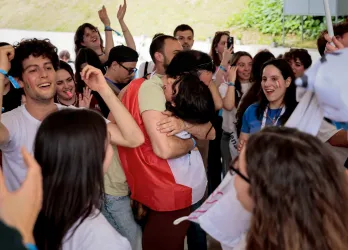 Young people are celebrating EGM Split 2026, hugging