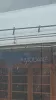 A snowy view of the Modane station sign seen through a train window.