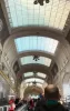 A view of the high, vaulted glass and steel ceilings inside the monumental Milano Centrale station.