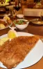 A close up photo of a large Italian breaded cutlet.
