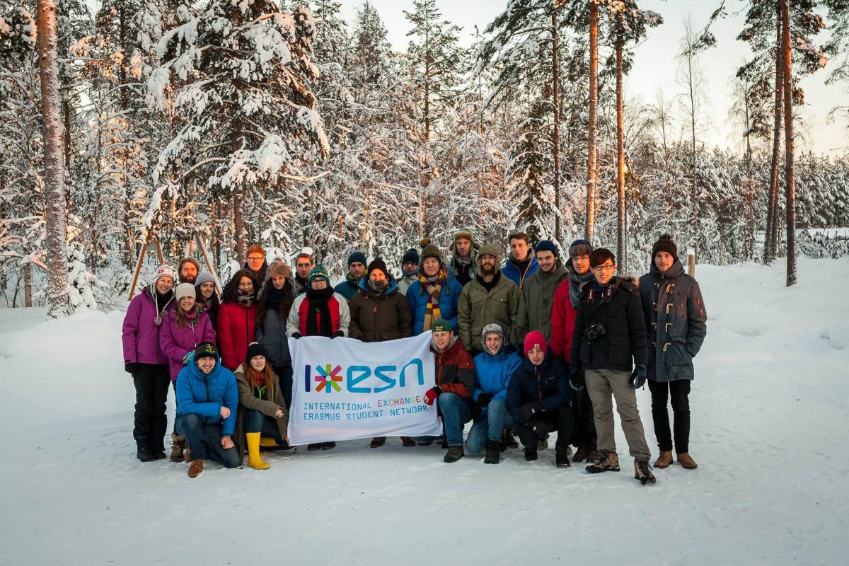 group picture with esn flag in the snow