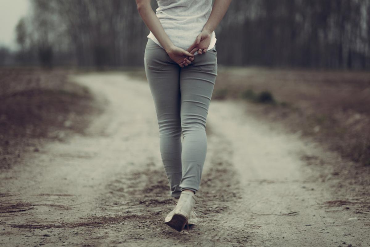 Woman walking on a road