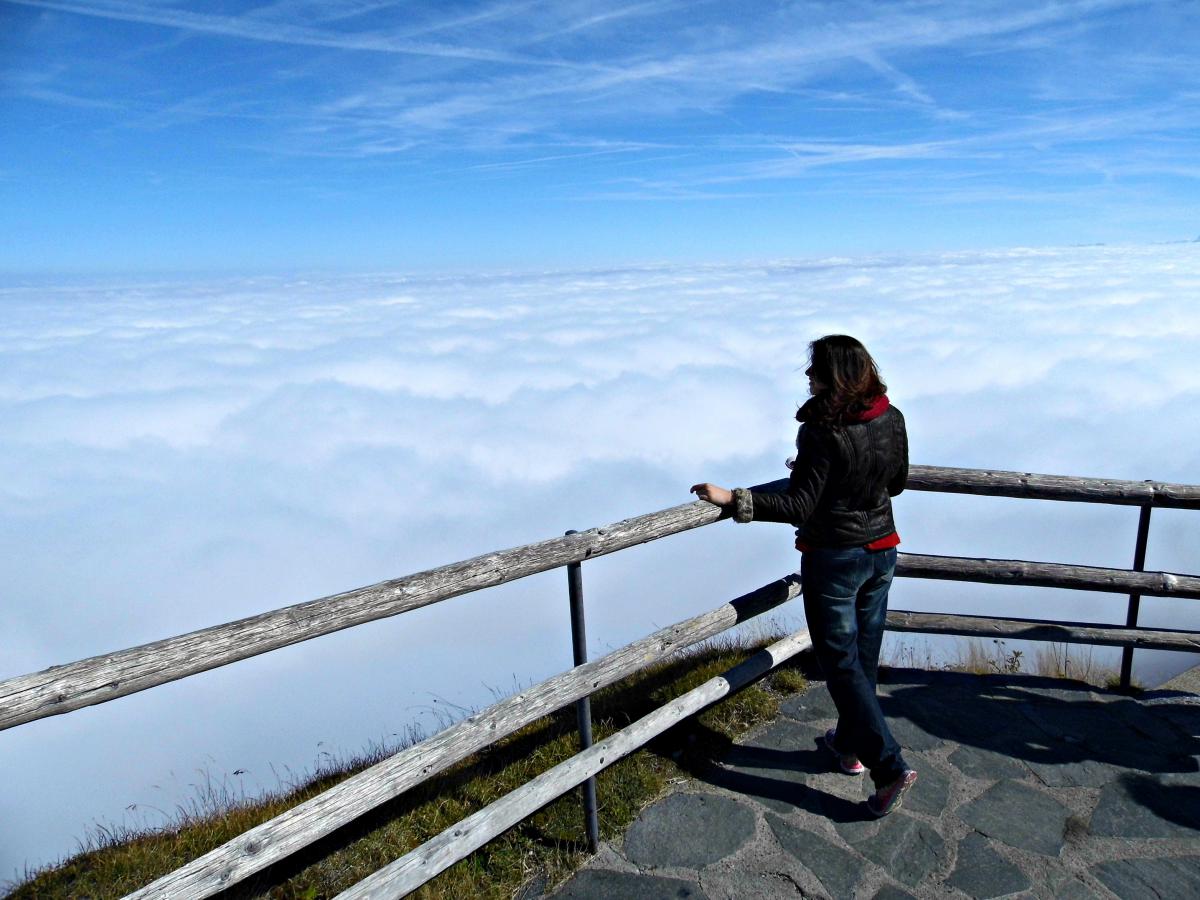 someone looking at sky above the clouds