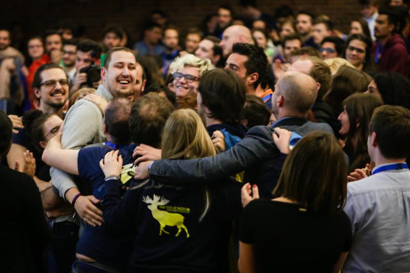 people hugging in crowd