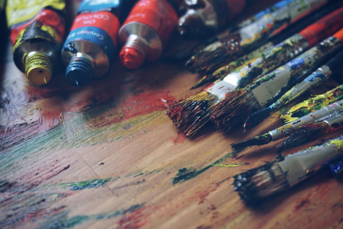brushes and paint on table, close-up