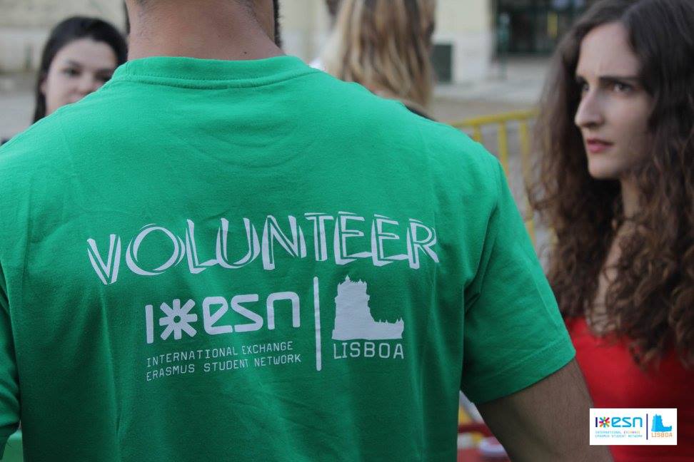 focus on someone's shirt with esn logo and world 'volunteer'