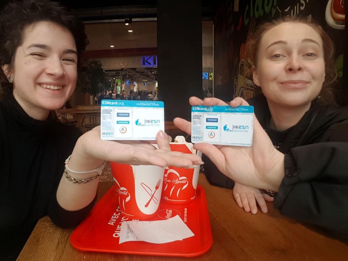 two women showing their esn cards