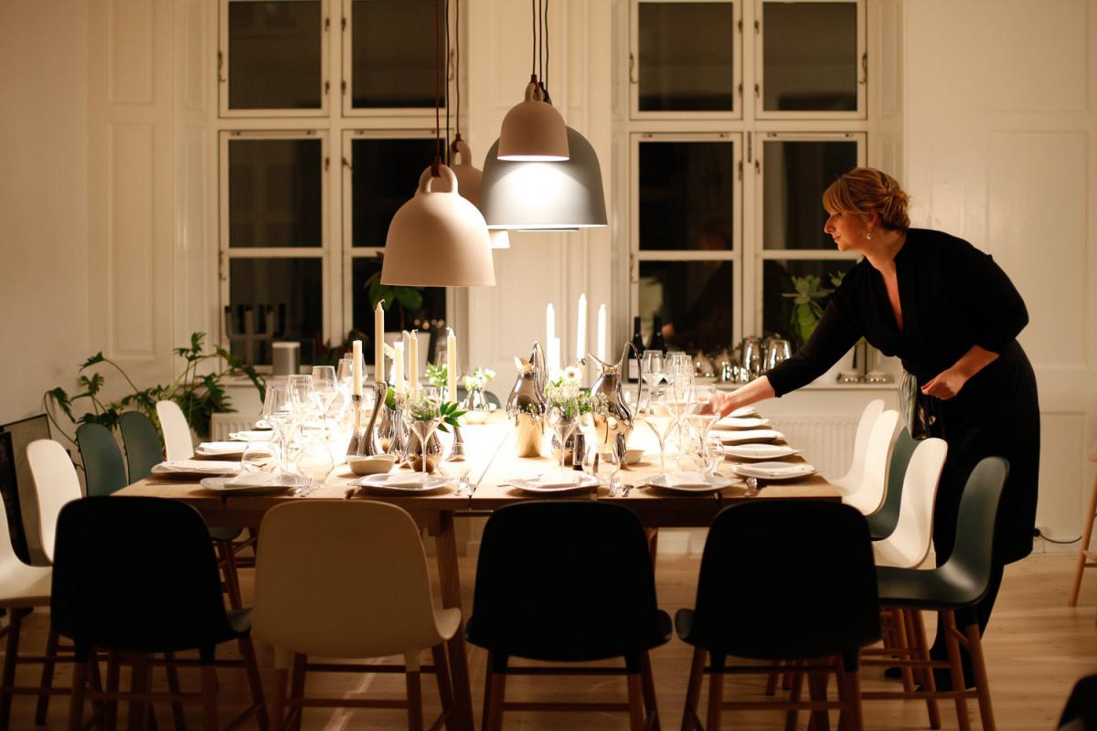 woman adjusting festing table