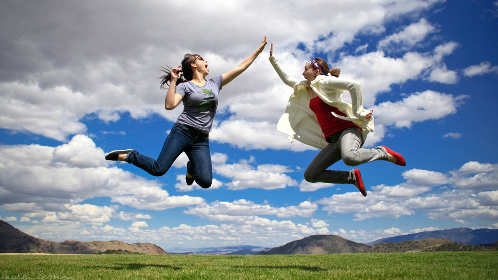 two people jumping in the air