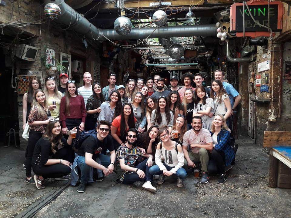 friends group picture in industrial looking bar