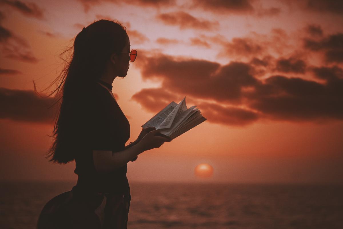 woman reading at dawn