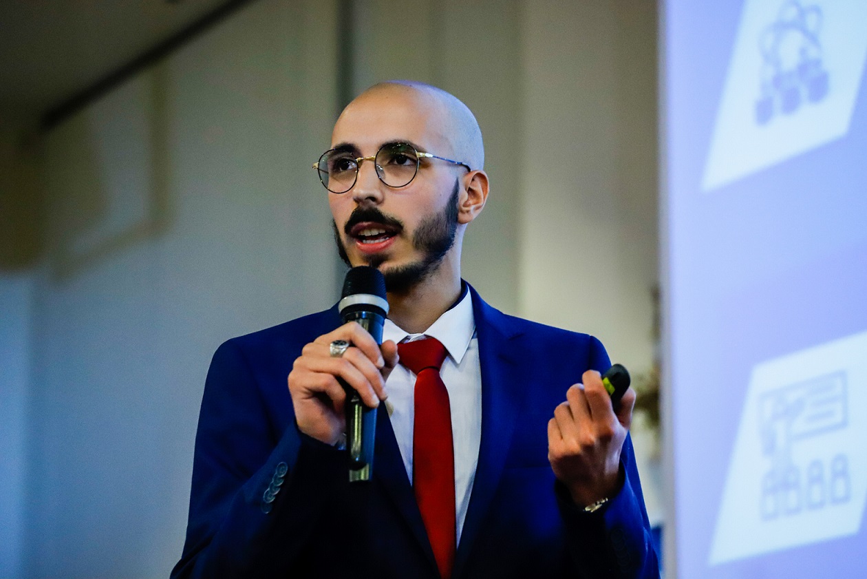 man talking on stage