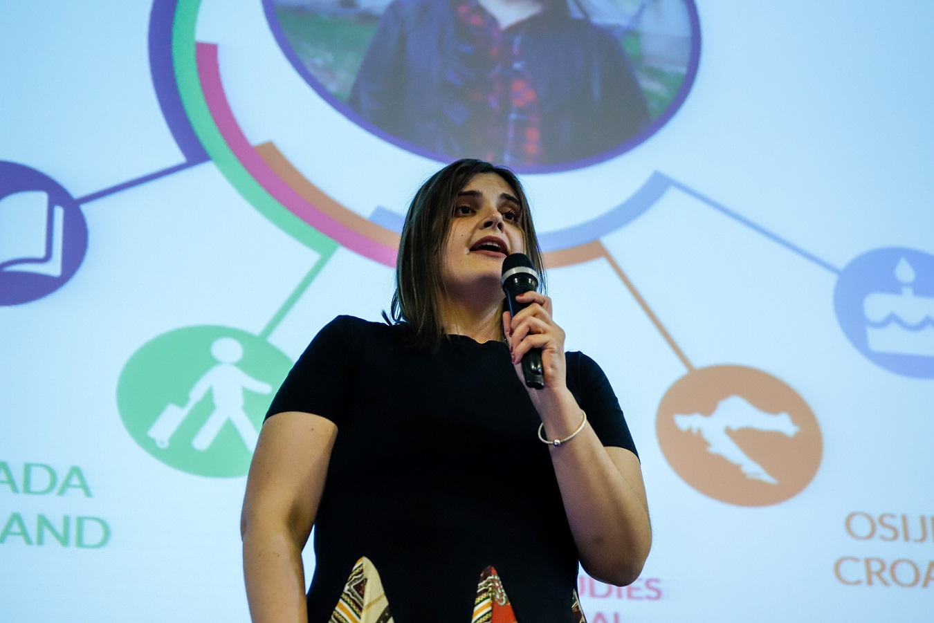 woman talking on stage