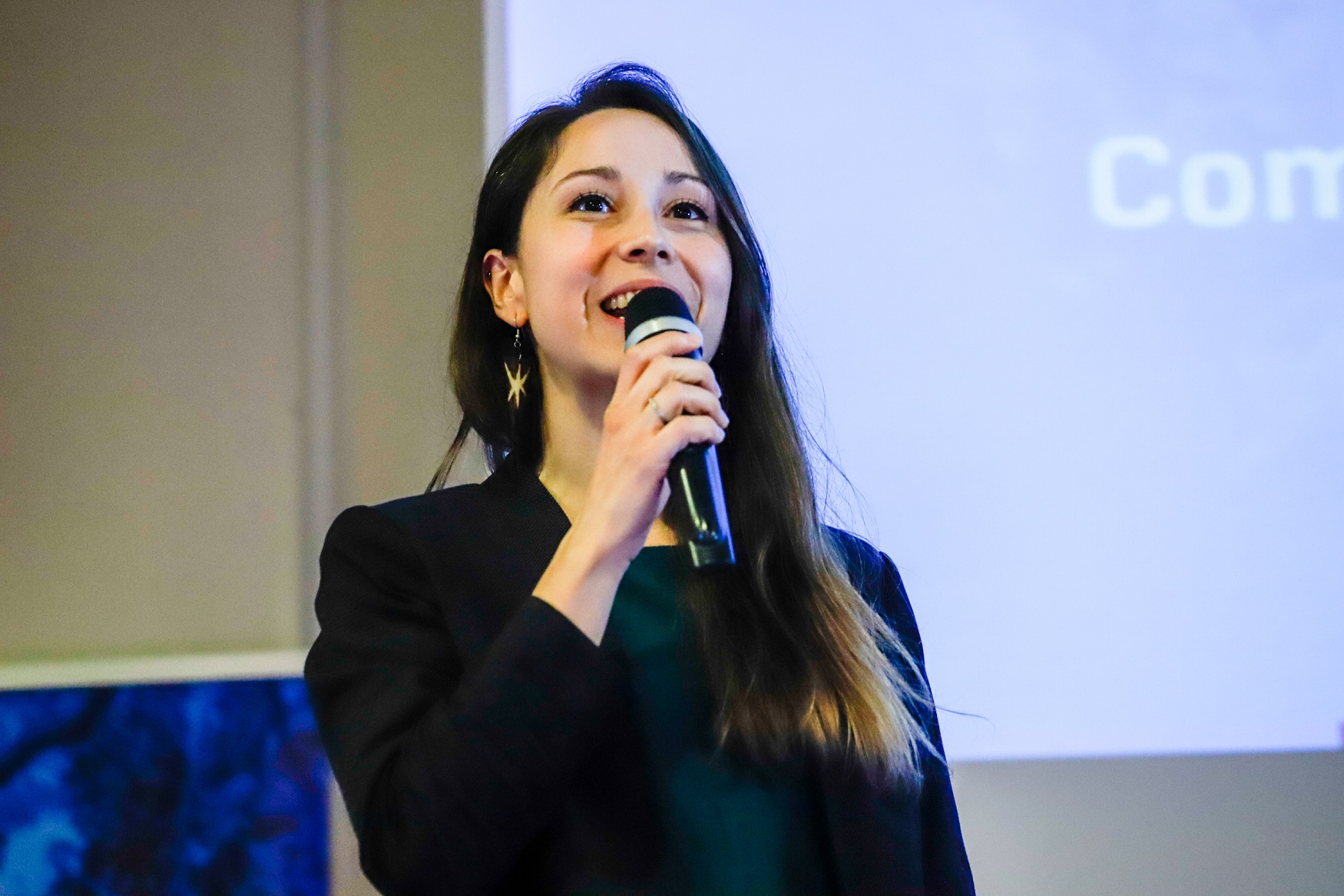 woman talking on stage