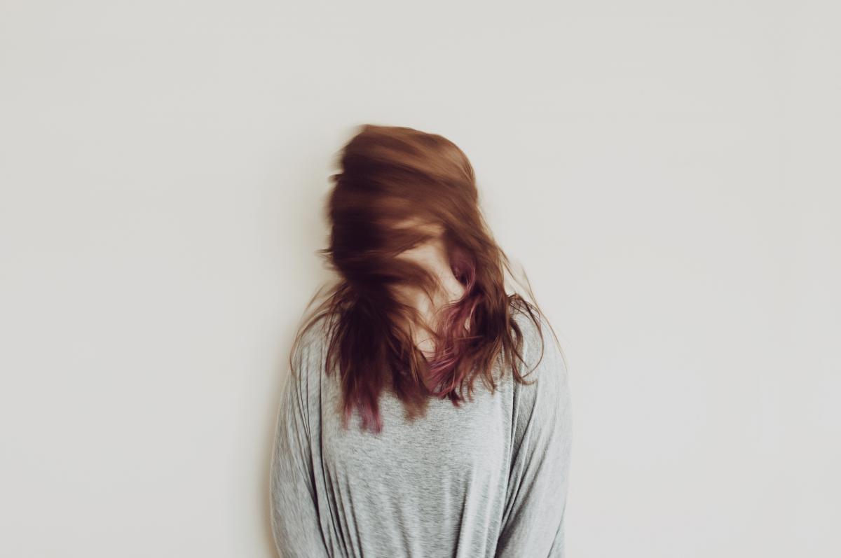 woman with hair in front of face