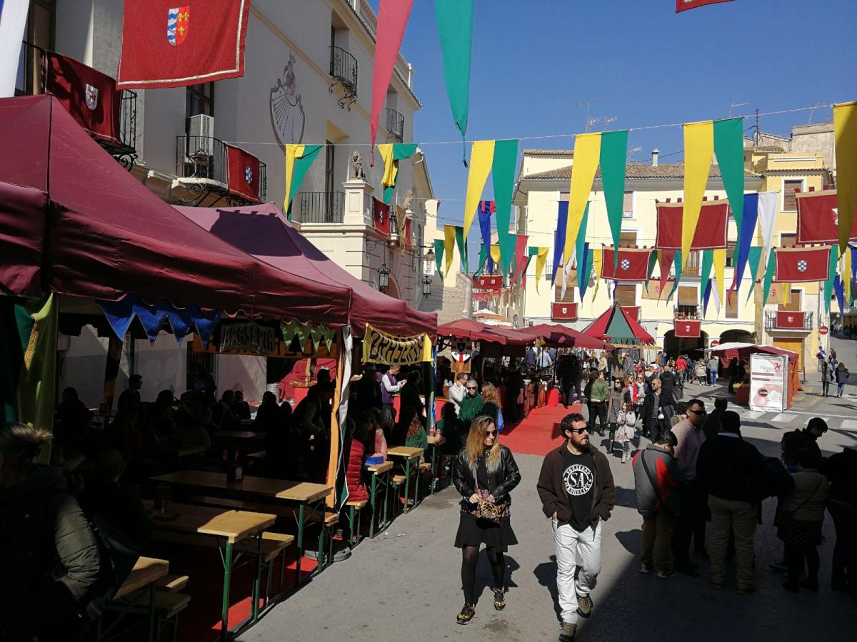 event in city with flags and stands