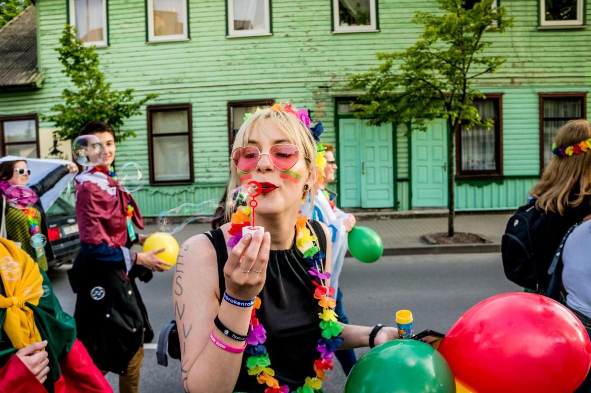 girl blowing soap bubbles