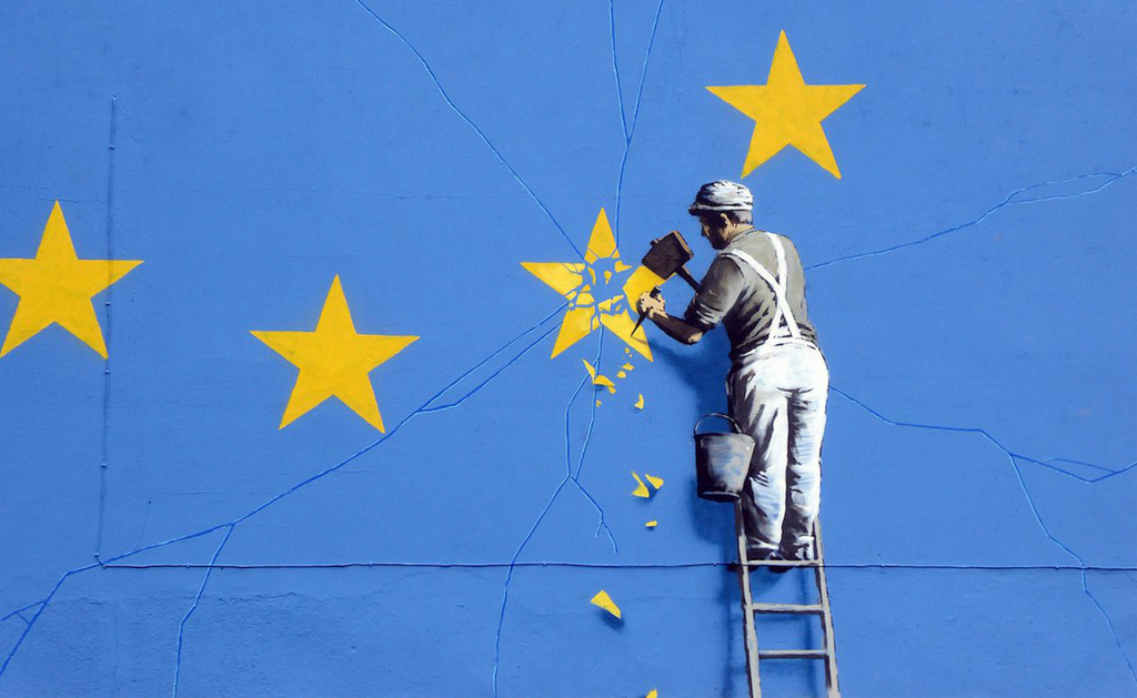painting of a worker breaking a star of UE flag