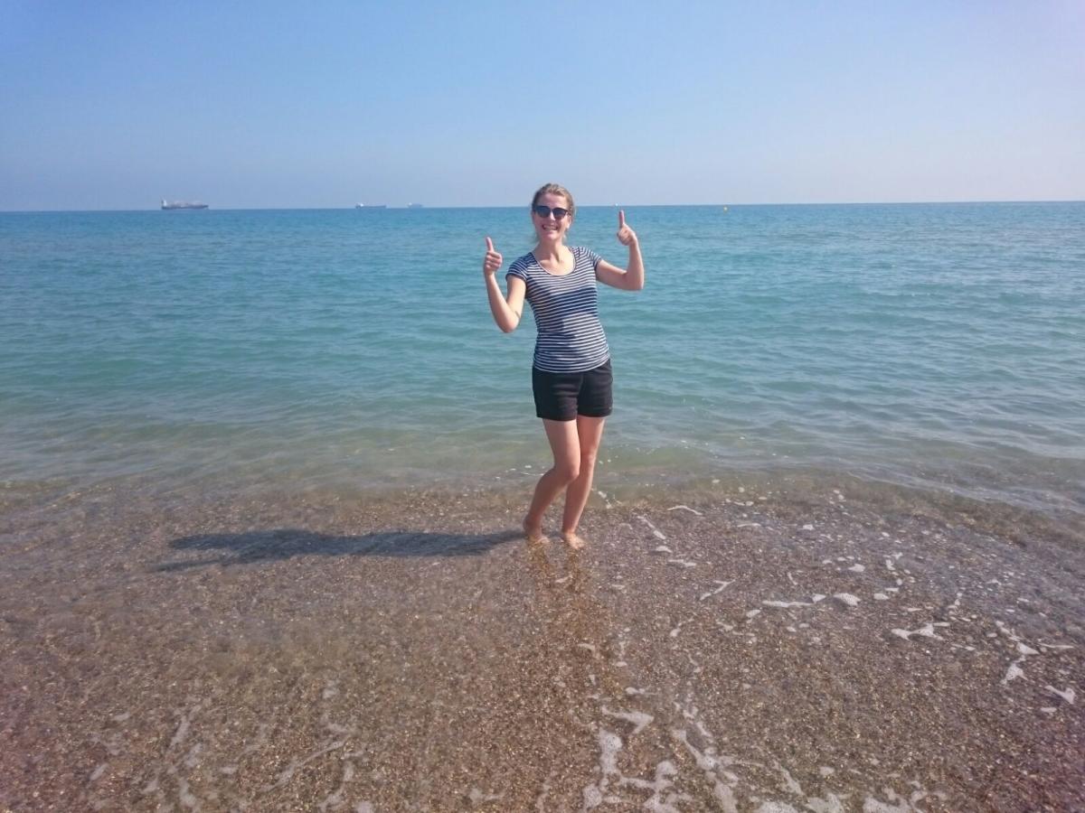 woman with feet in the sea