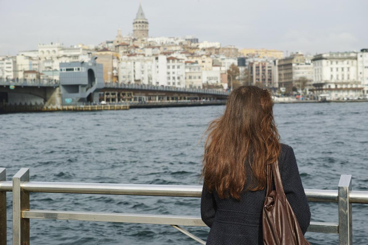 woman looking at sea from boat