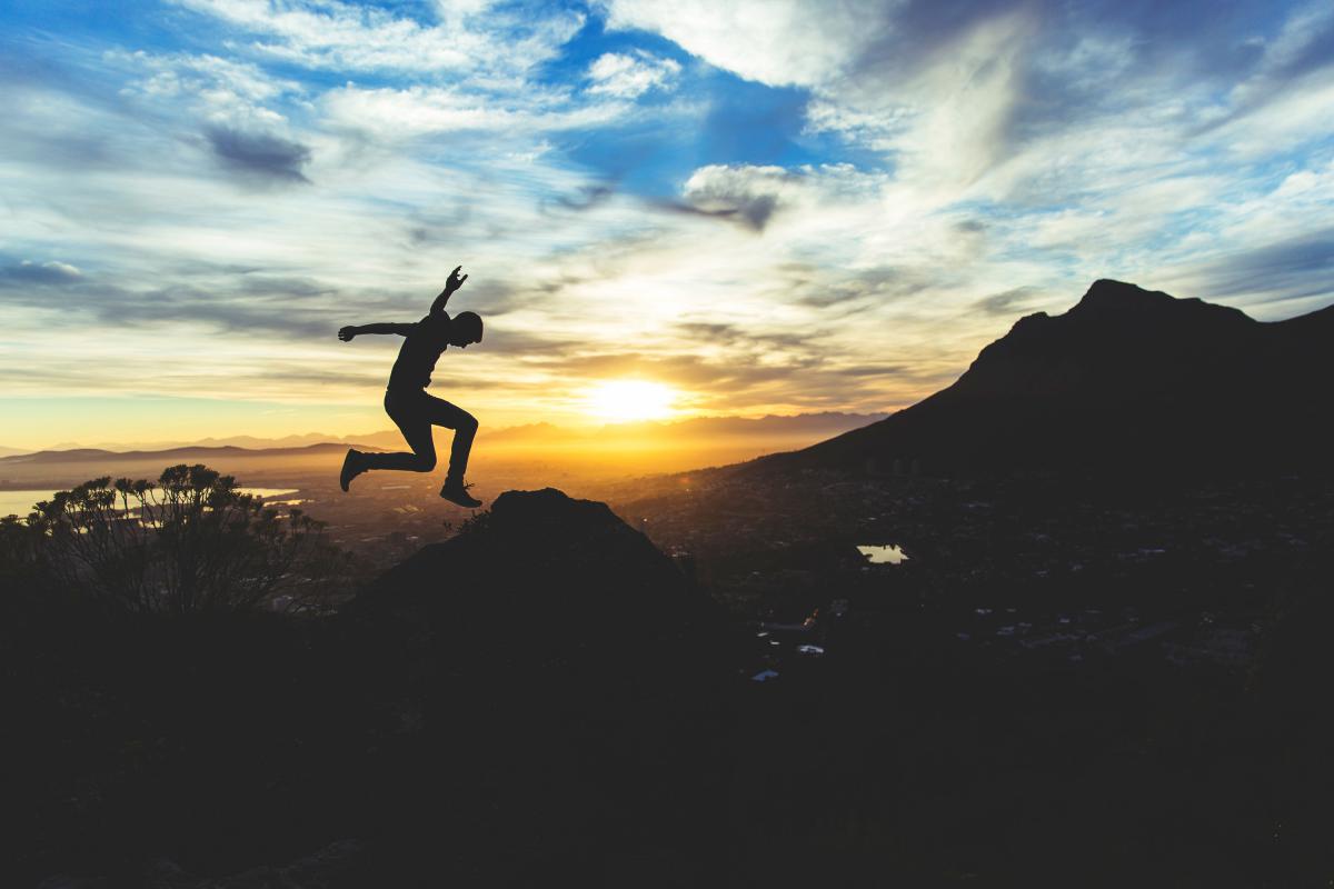 someone jumping over landscape