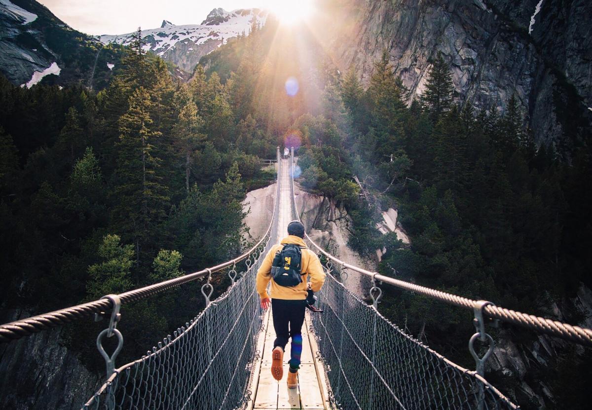 someone crossing a bridge