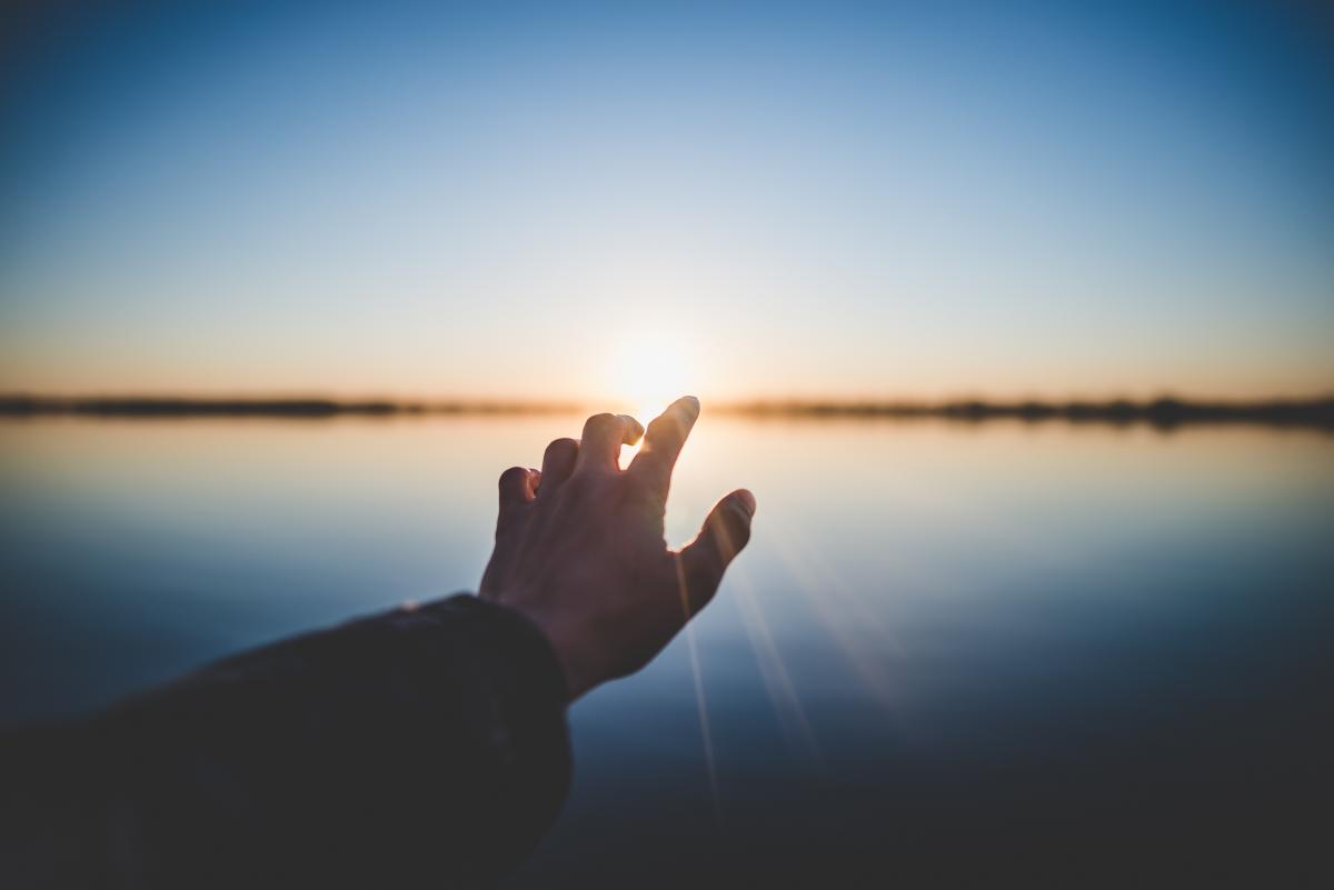 hand touching horizon