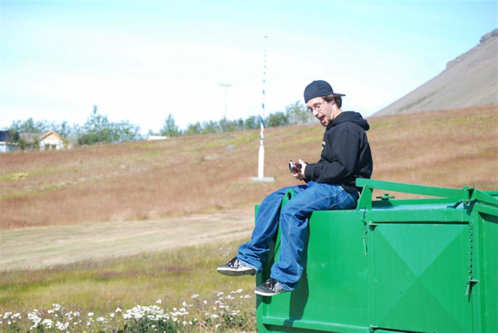 Patrick sitting on a container