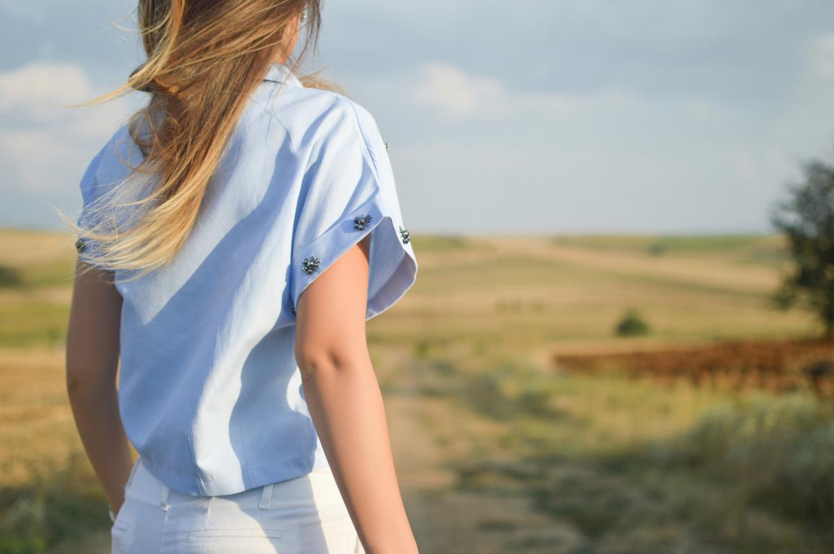 woman from back looking at field