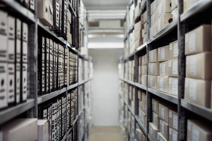 alley with bookshelves with files