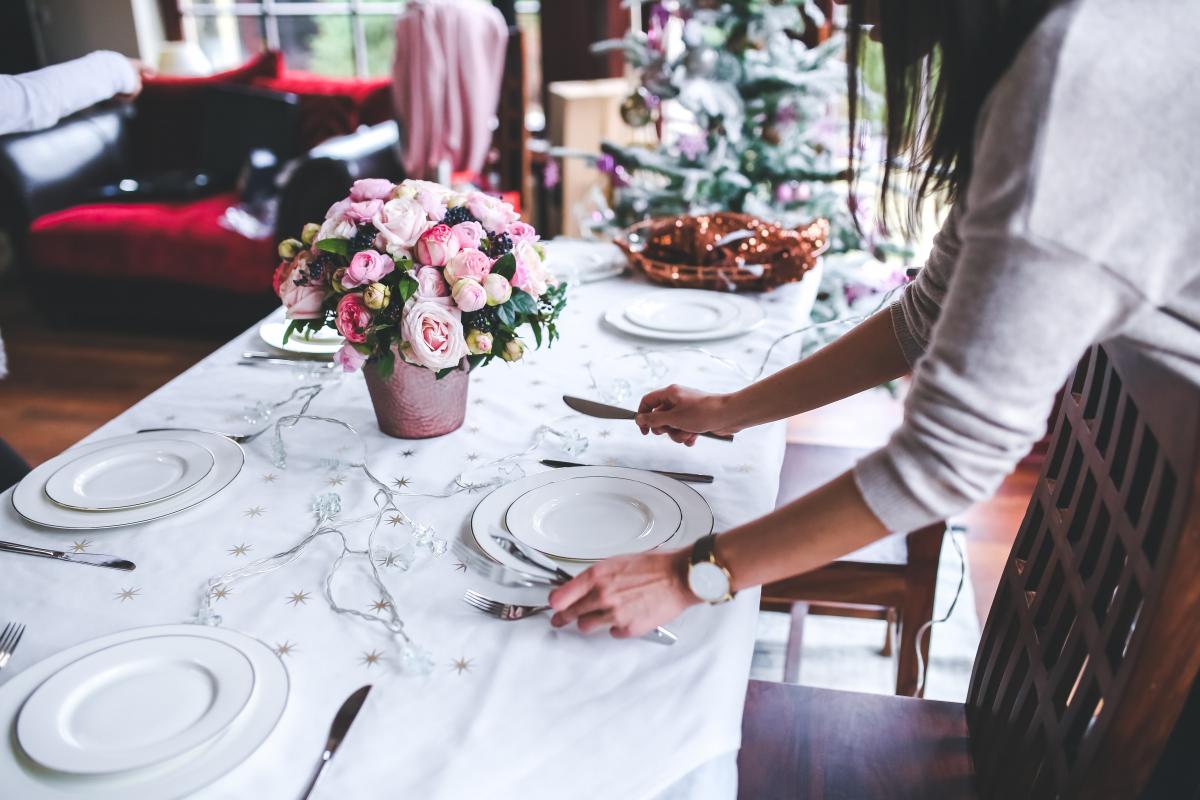 woman preparing christmas table