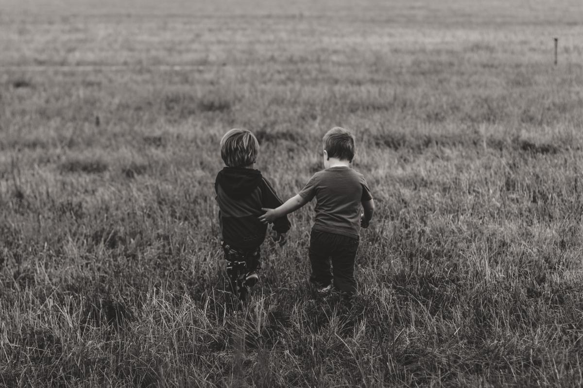 children walking in grass