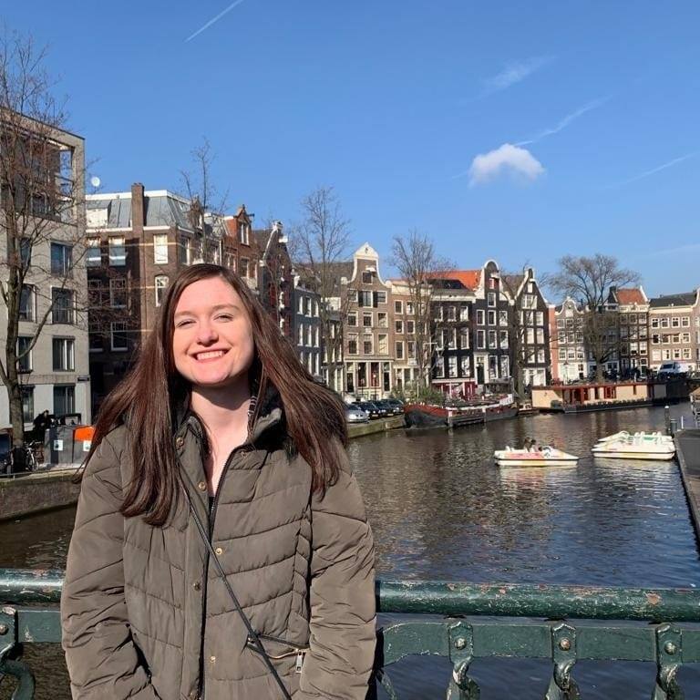 woman posing in front of the canal