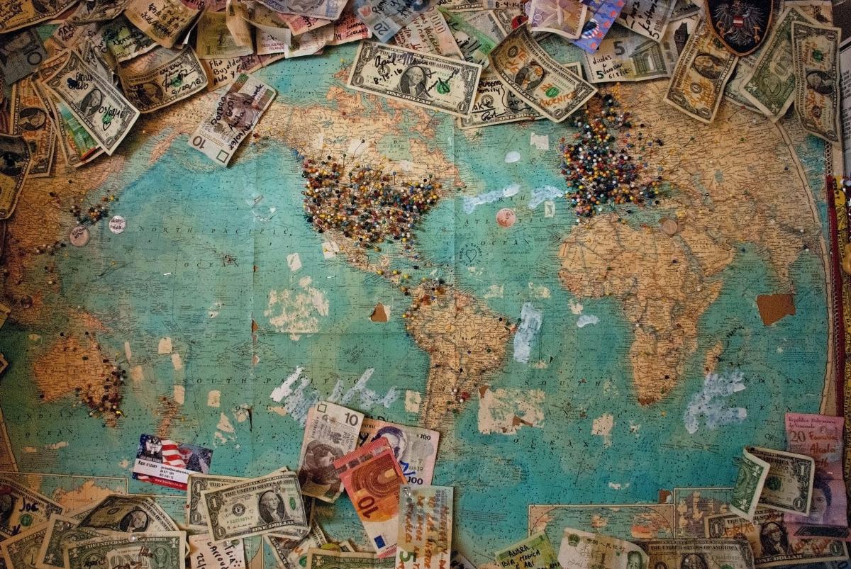 banknotes on world map