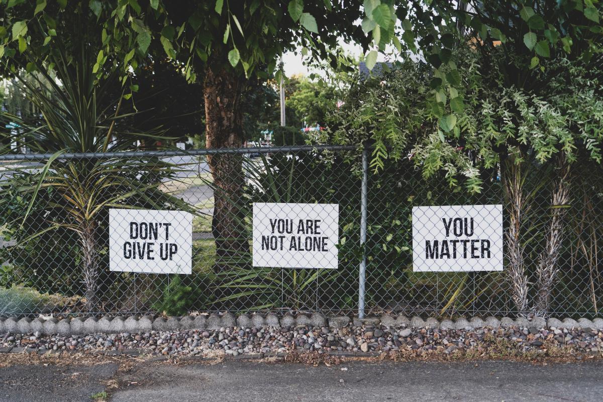 signs behind fence