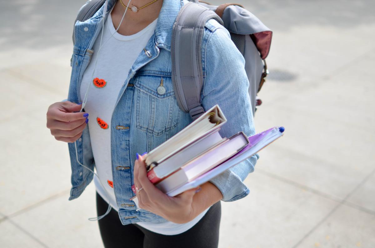 holding books