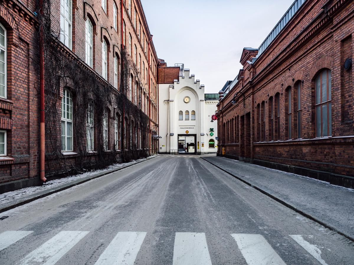 empty street between brick buildings