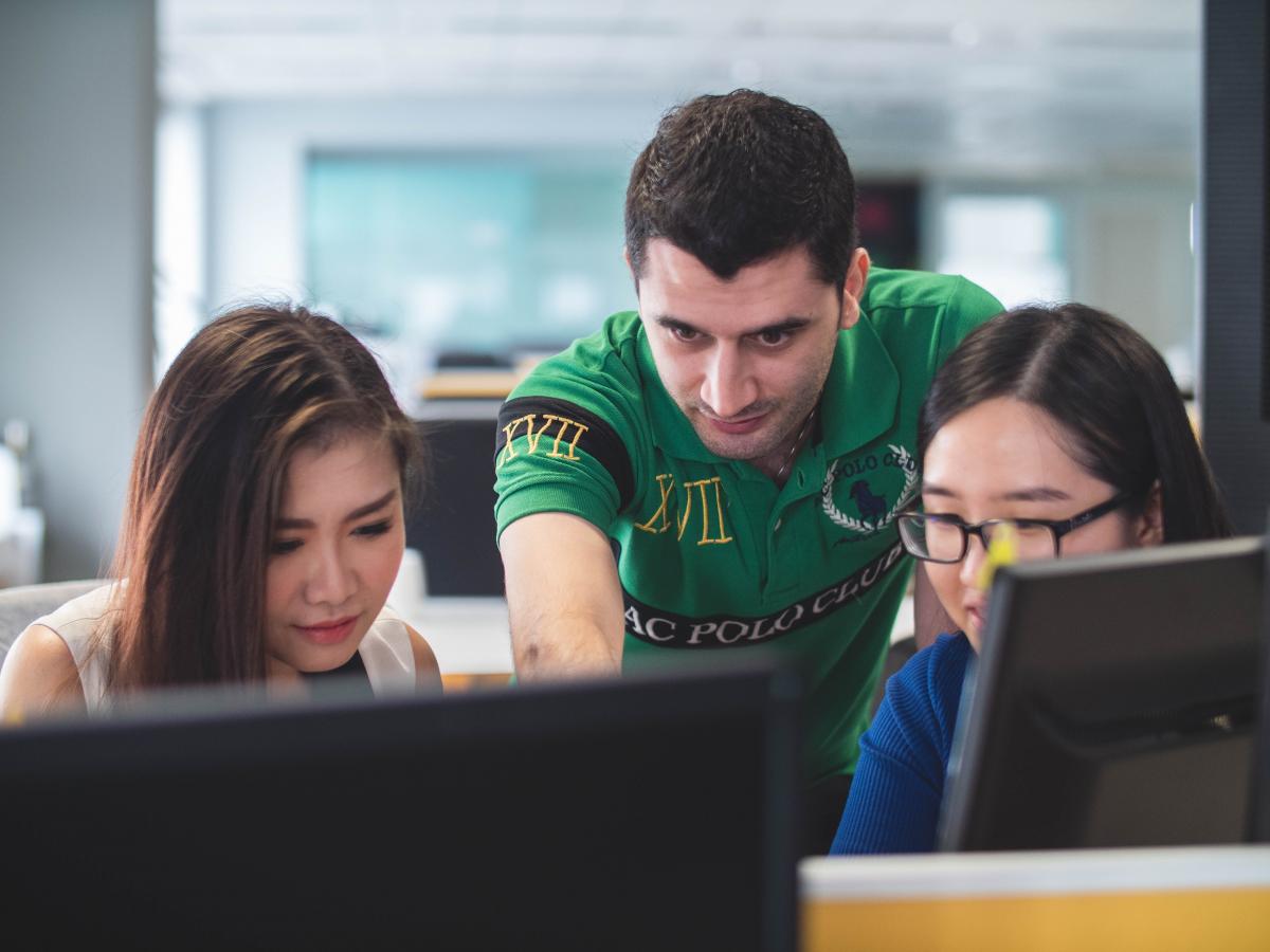 people working, computers in front