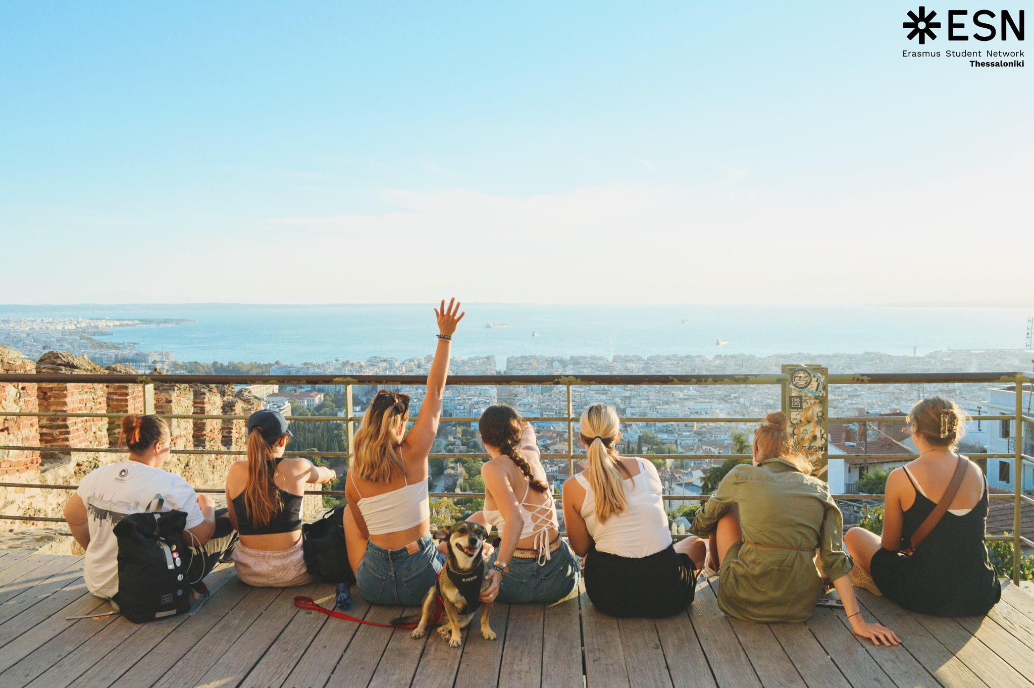 A group of exchange students sitting at the seaside