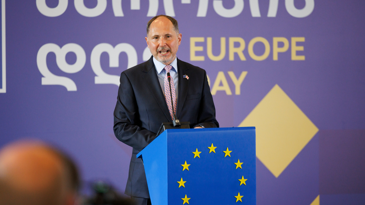 A person giving a speech on a Europe Day in Georgia.