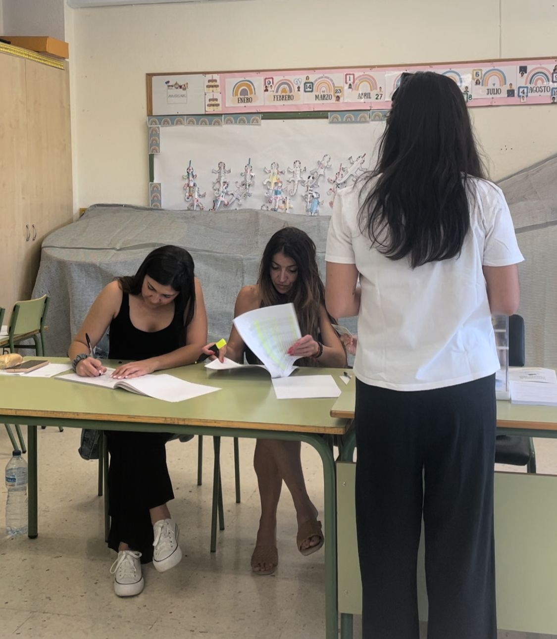 A young woman voting.