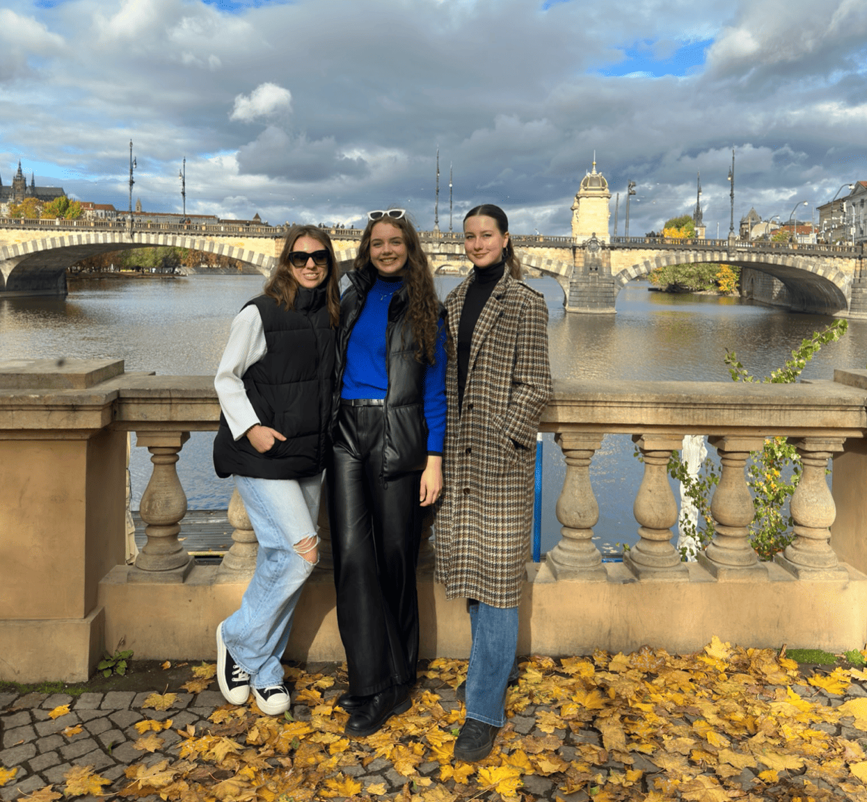 PHOTO 1: Saulė, with two friends, near a bridge in Pilsen