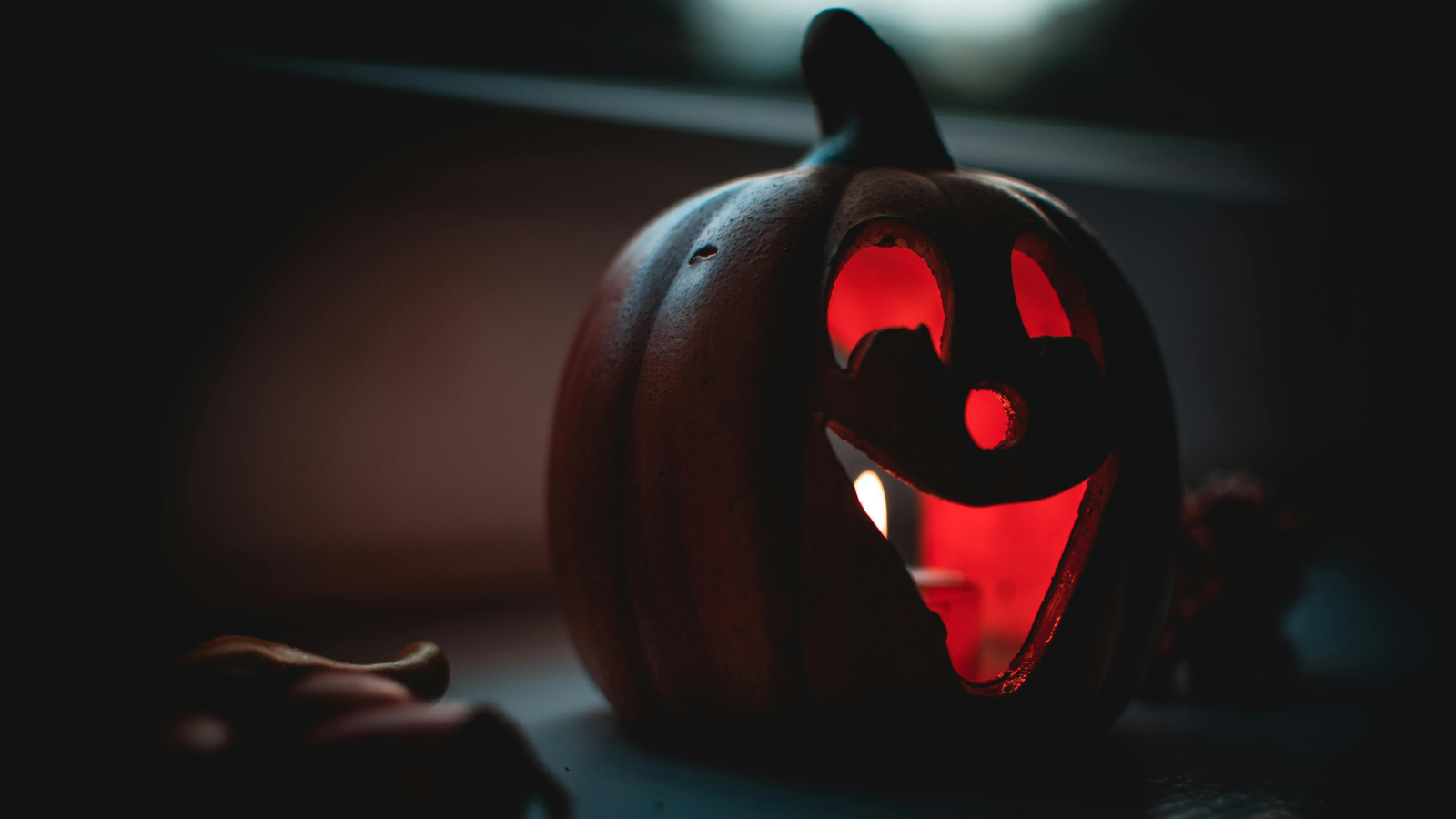 A pumpkin with a face carved for Halloween