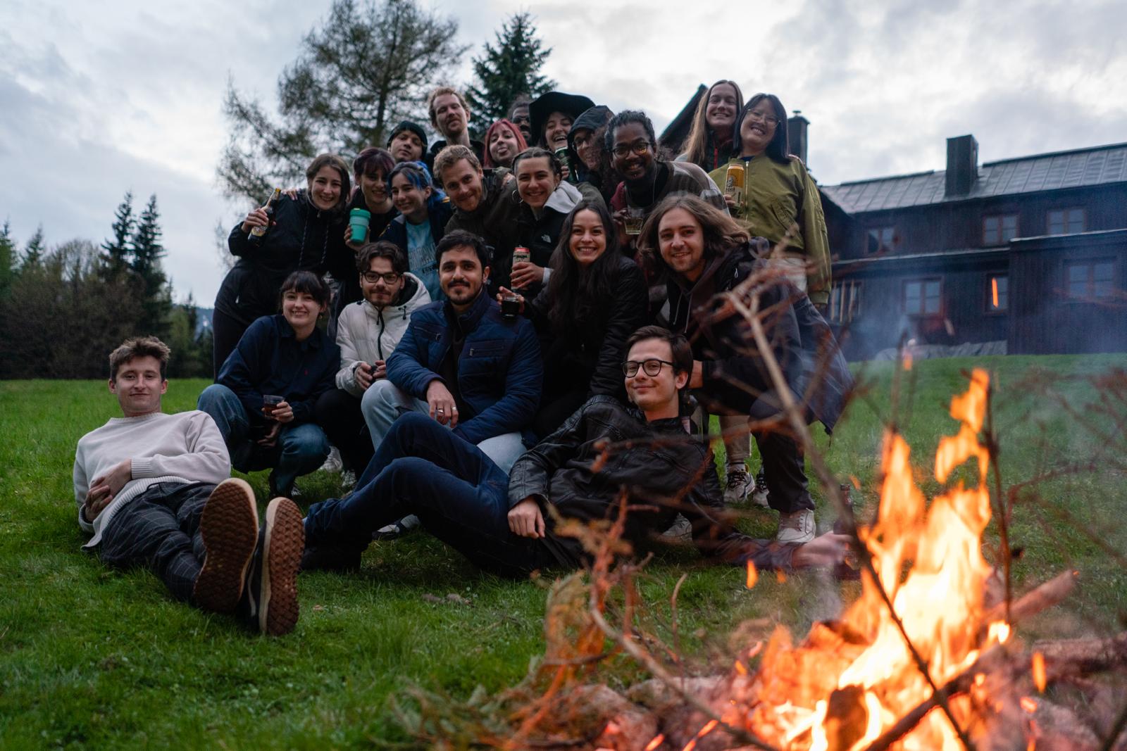 Marina and her friends in front of a bonfire