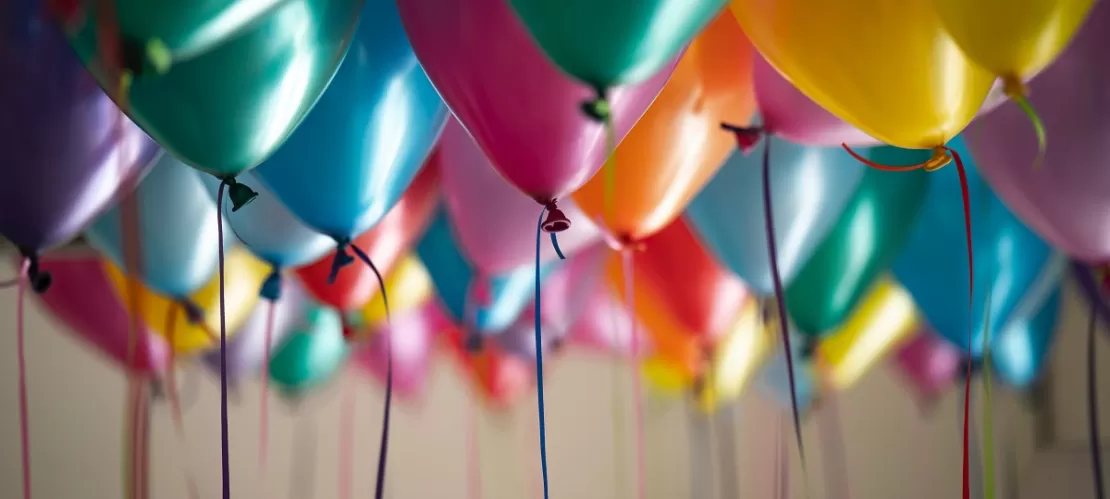 selective focus photography of assorted-color balloons