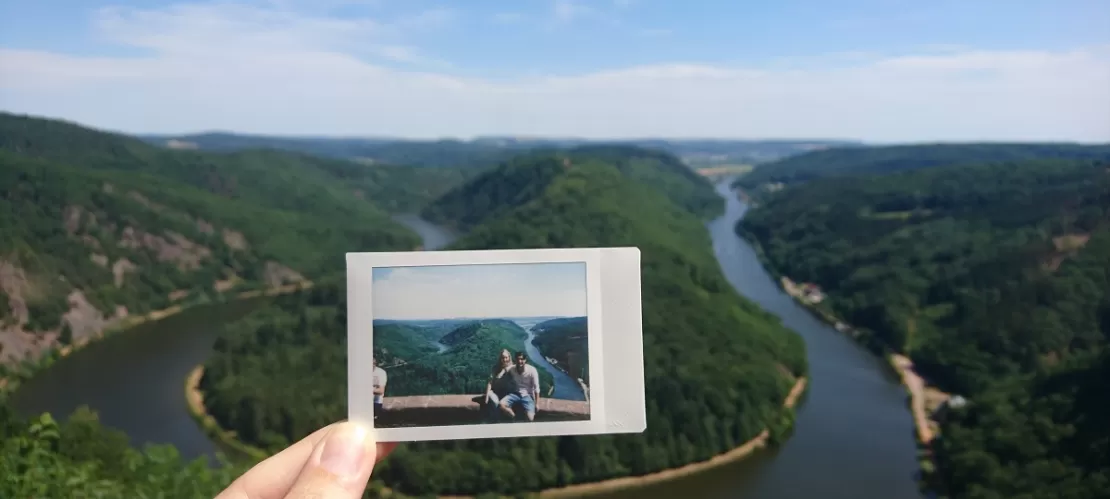 couple picture in front of same landscape