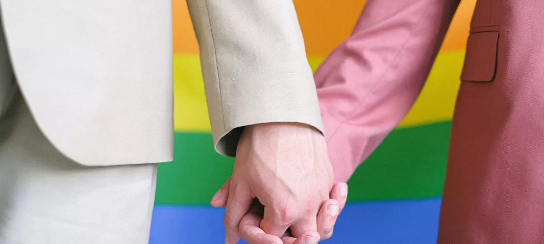 close-up on two persons holding hands