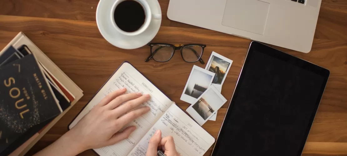 person writing in a notebook