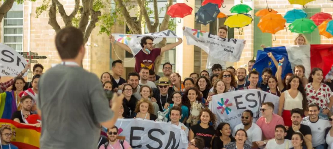 audience with esn flags, speaker in front from back